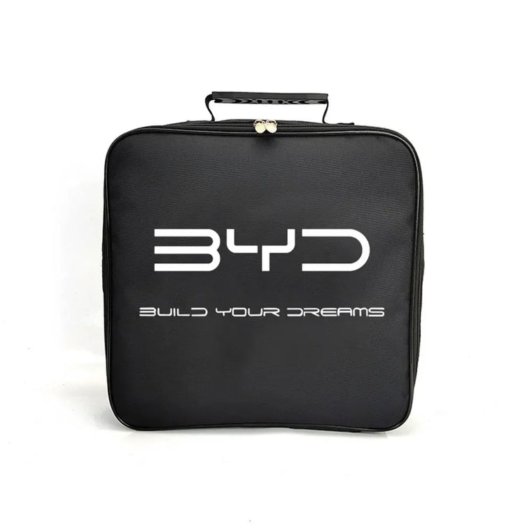 BYD electric vehicle charging cable storage bag on car boot carpet, part of a new EV owner accessory checklist