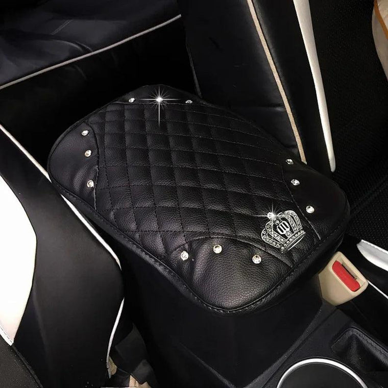 Leather armrest cushion with built-in console storage in a car interior