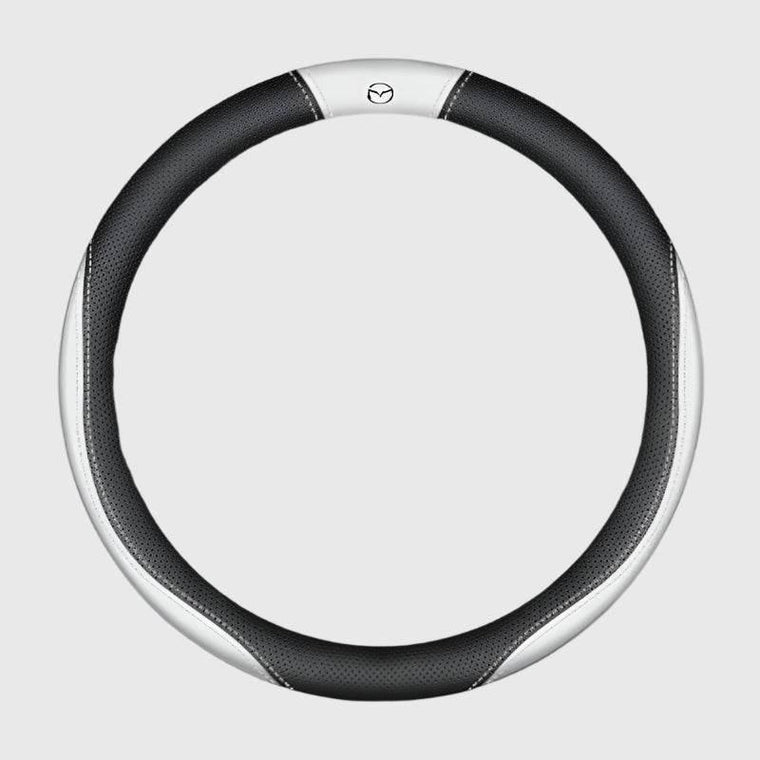 Steering wheel cover on a car rim showing grip texture, used to illustrate why covers slip, fade and crack