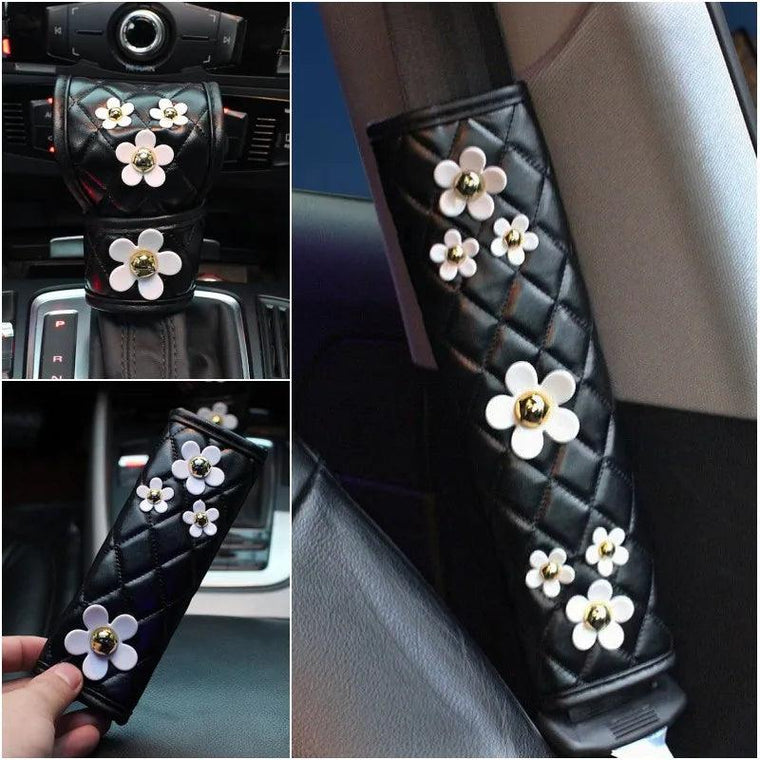 Daisy floral leather gear shift, handbrake and seat belt cover set in a car interior