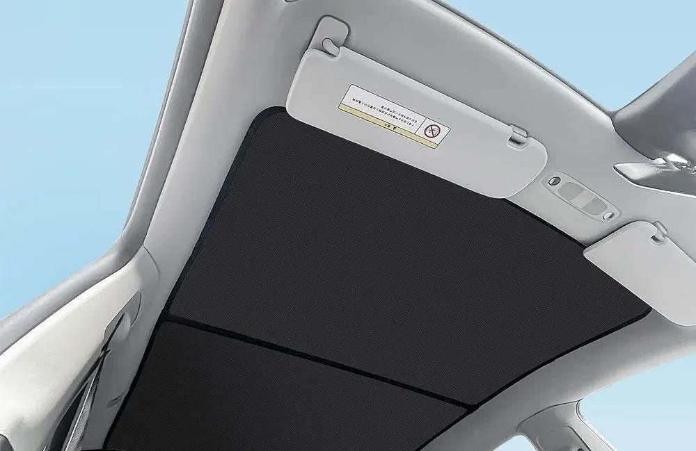 Custom-fit car sunshade protecting a vehicle interior from UV damage