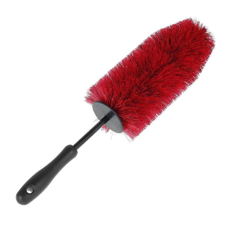 Cleaning car wheels and tyres with a soft bristle brush