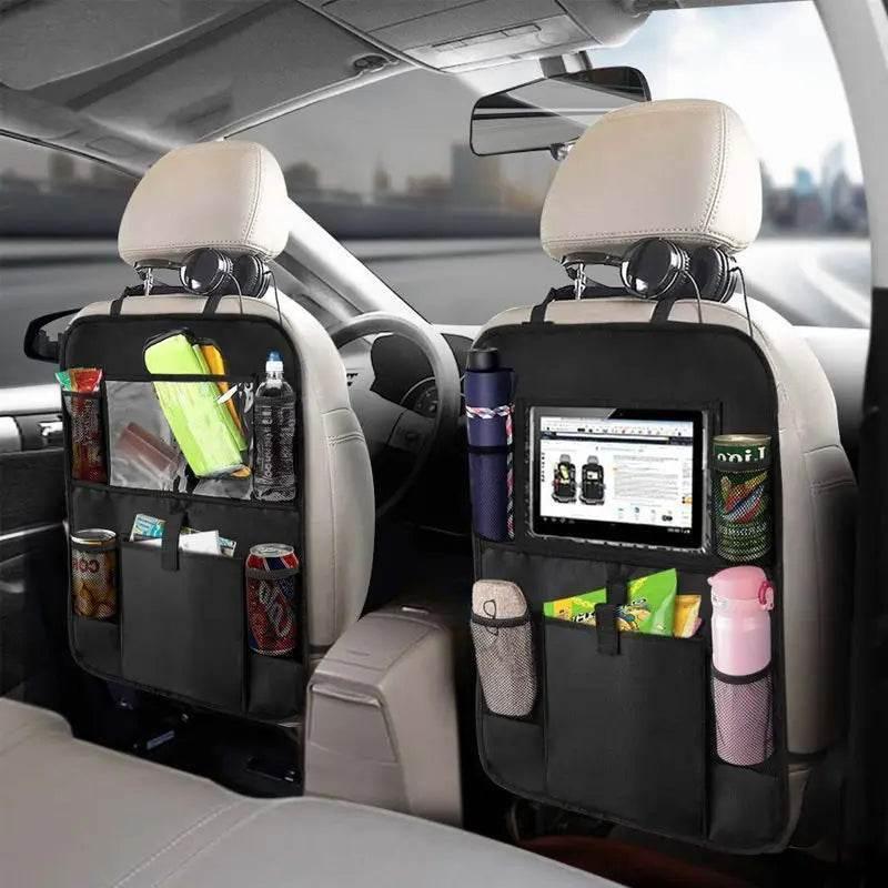 Car backseat organiser with clear tablet holder set up for kids on a family drive