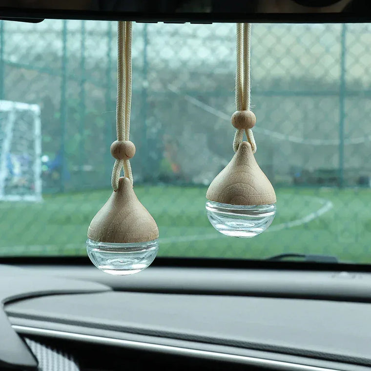 Round car perfume bottle ornament essential oil diffuser on a dashboard