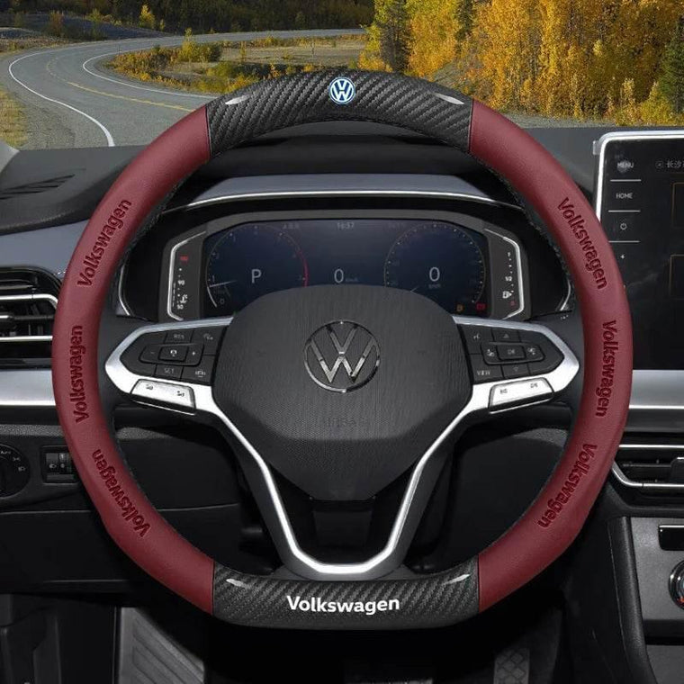 Breathable carbon fibre and suede steering wheel cover fitted to a car