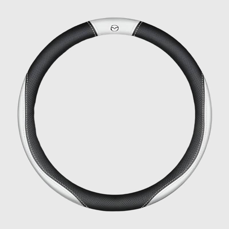 Steering wheel cover on a car rim showing grip texture, used to illustrate why covers slip, fade and crack