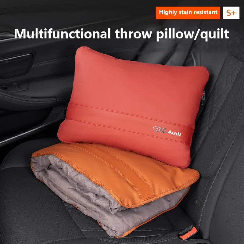 Audi 2-in-1 car pillow blanket folded into a waist cushion on a car seat