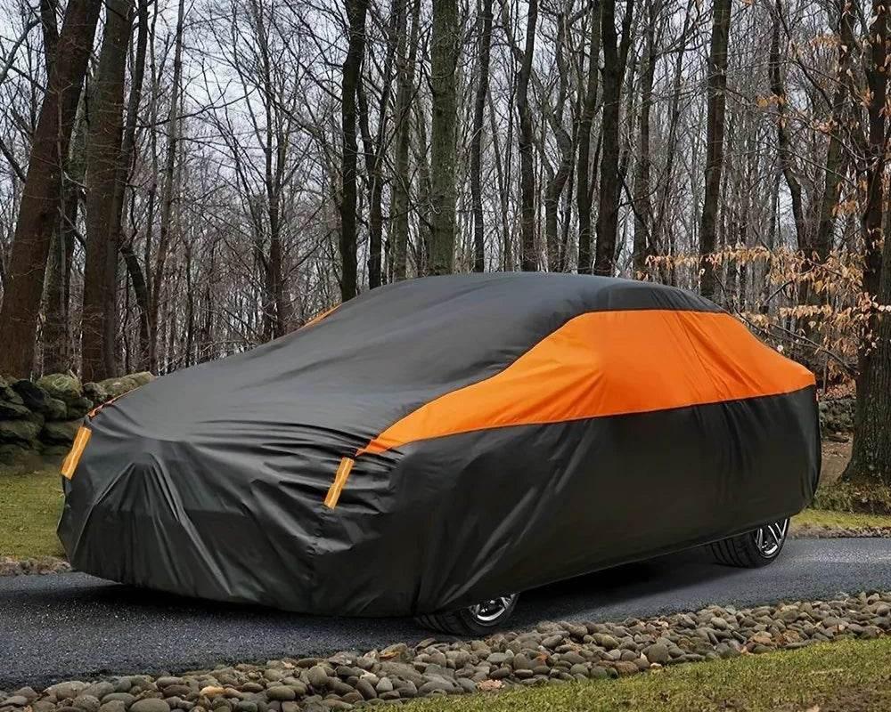 Universal waterproof car cover protecting a sedan parked outdoors