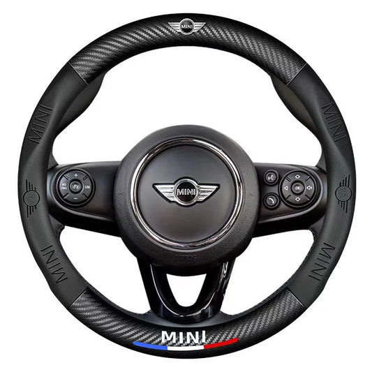 Black steering wheel with MINI logo on a white background